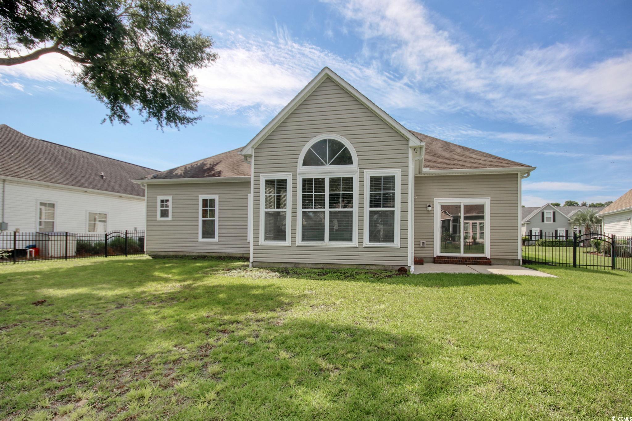 47 Pinfeather Drive Murrells Inlet, SC 29576 - Photo 23 of 35 Rear view of property with a patio and a shingled roof