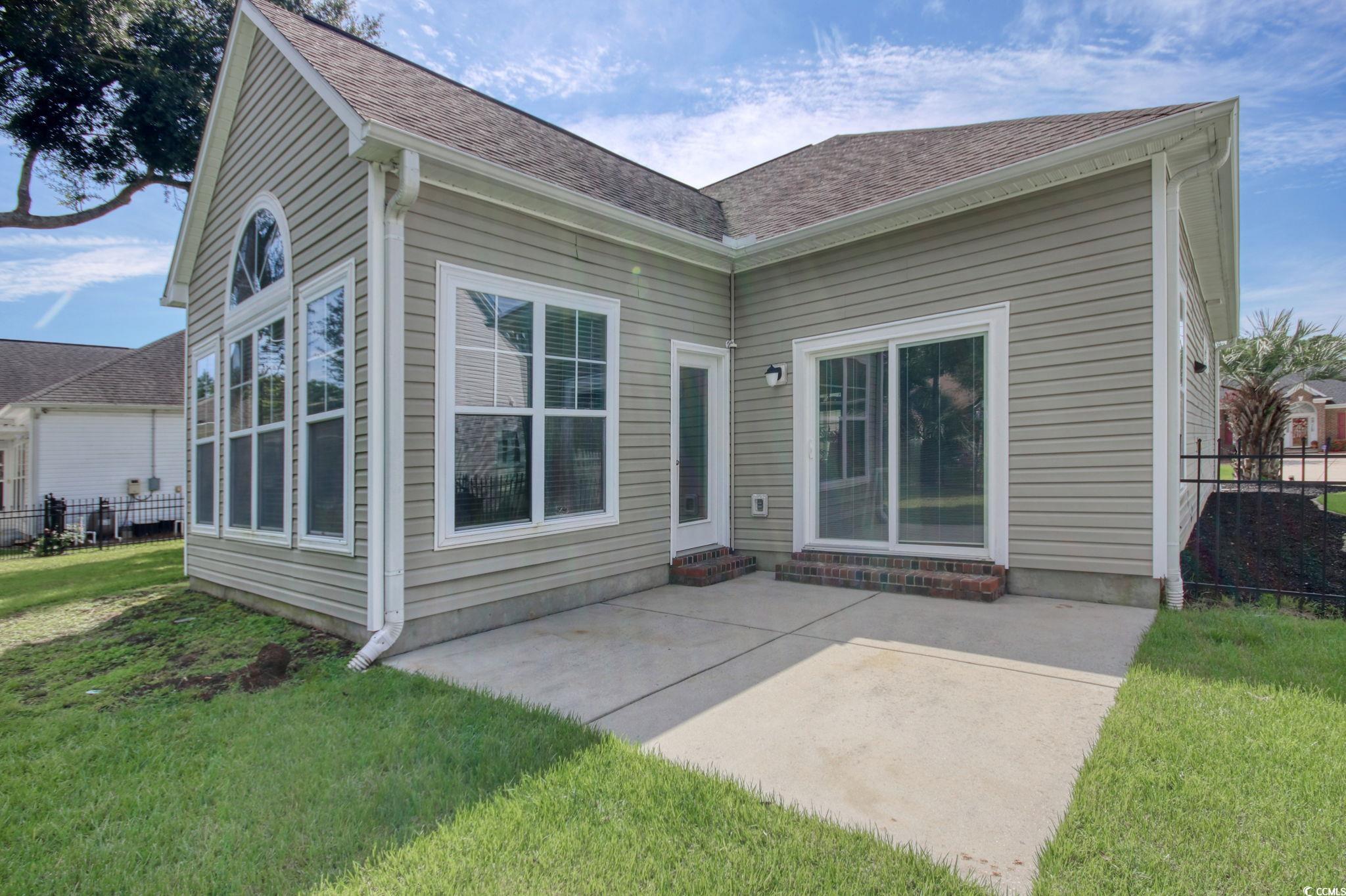 47 Pinfeather Drive Murrells Inlet, SC 29576 - Photo 24 of 35 Rear view of house featuring a patio area and a shingled roof