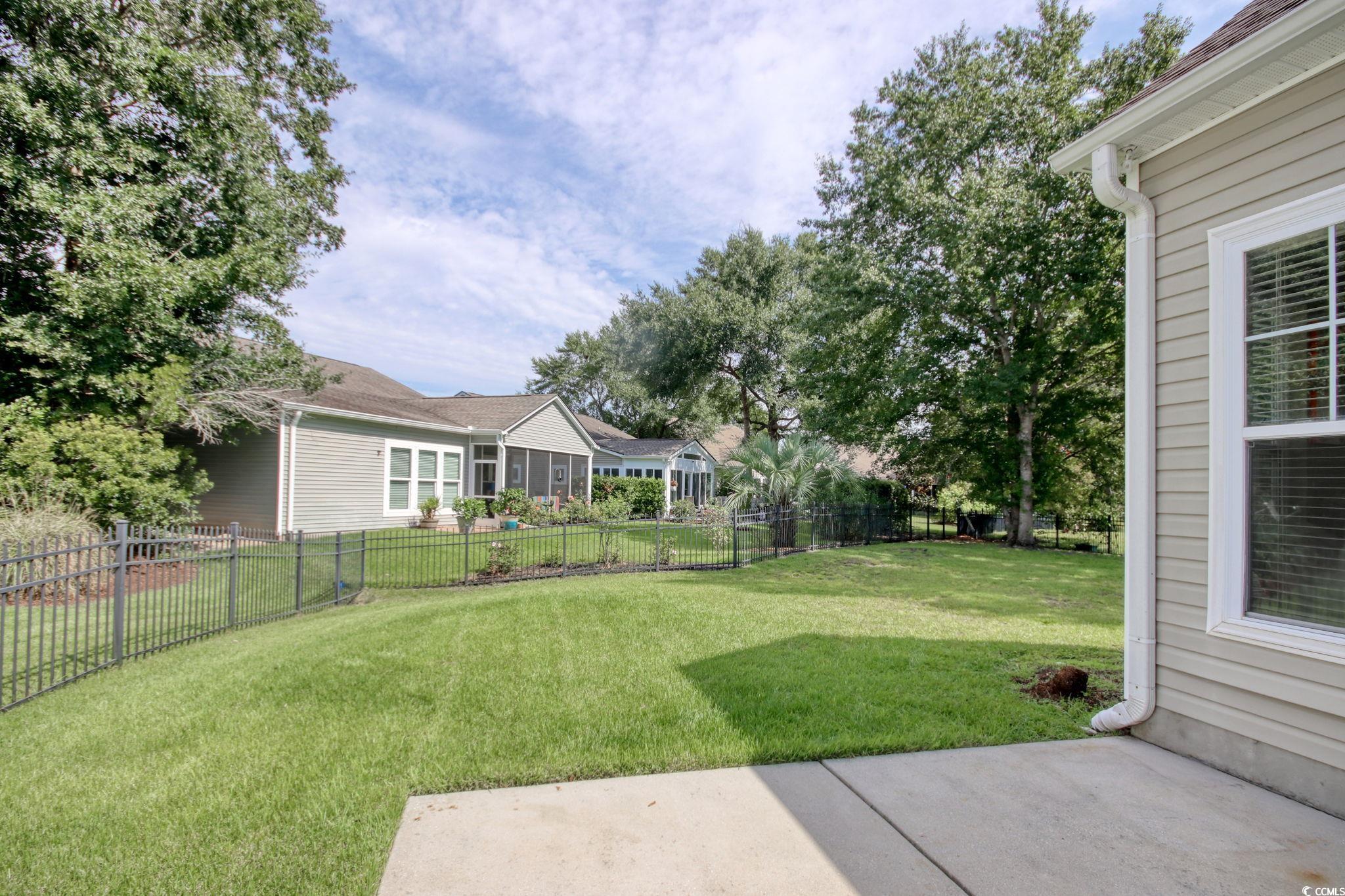 47 Pinfeather Drive Murrells Inlet, SC 29576 - Photo 25 of 35 Fenced backyard featuring a patio