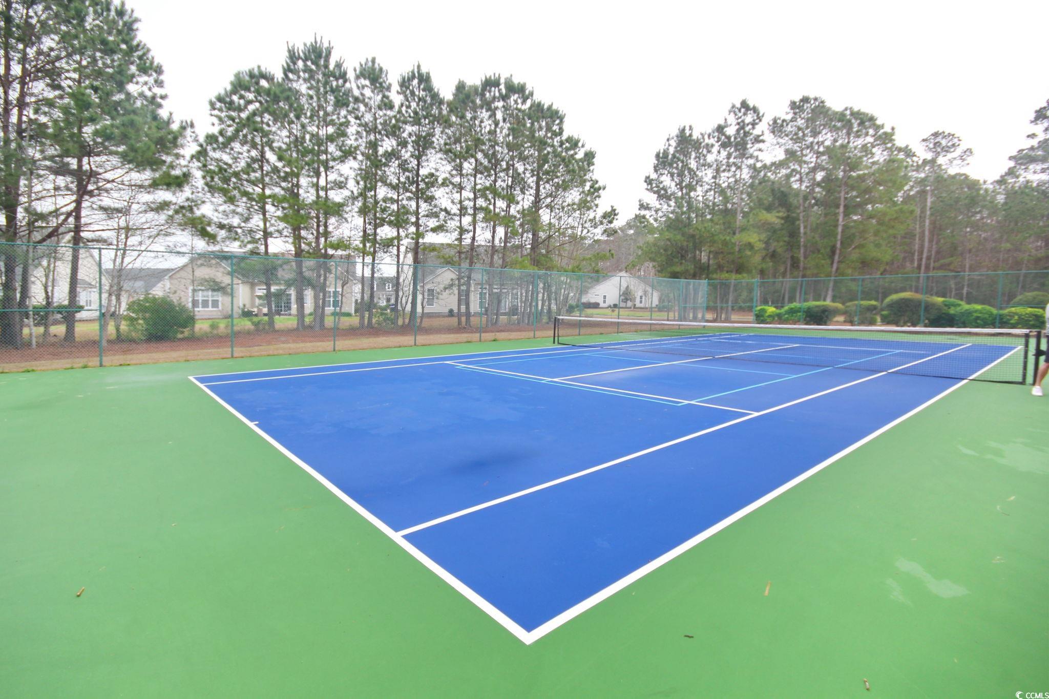 47 Pinfeather Drive Murrells Inlet, SC 29576 - Photo 26 of 35 View of tennis court with community basketball court and view of wooded area