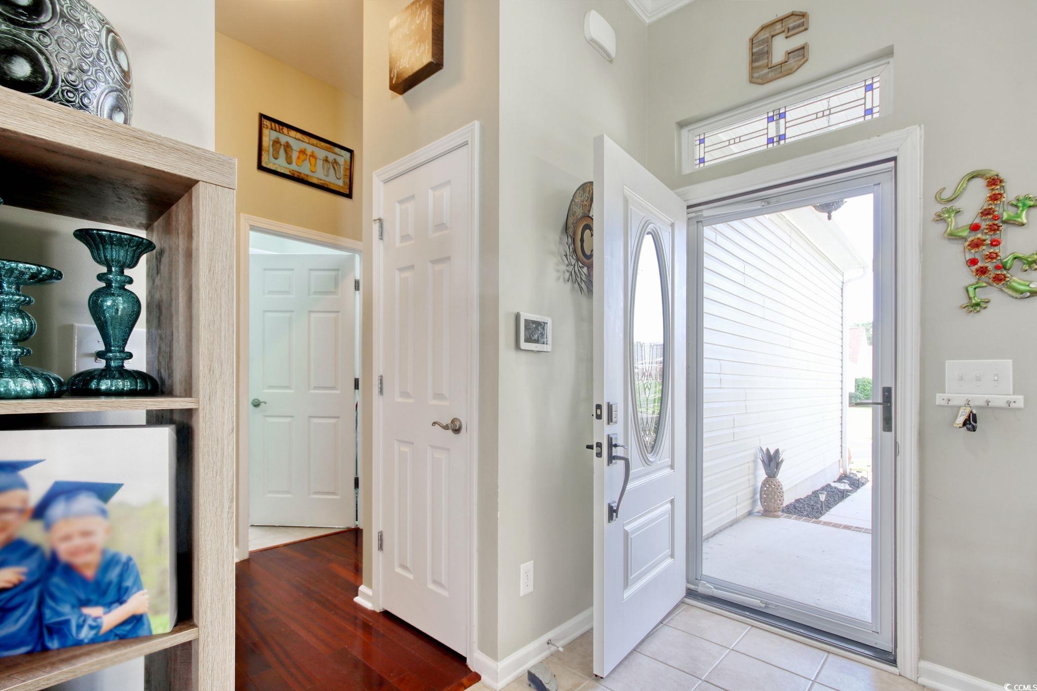 47 Pinfeather Drive Murrells Inlet, SC 29576 - Photo 5 of 35 Entrance foyer with baseboards and light tile patterned floors