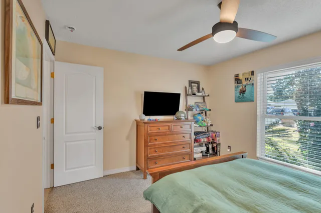a room with furniture and a flat screen tv