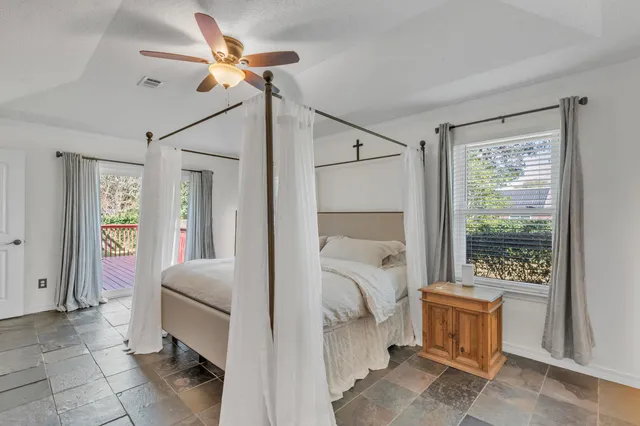 a room that has a bed and a window