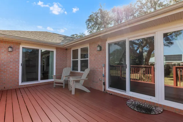 a view of a two chairs in the balcony
