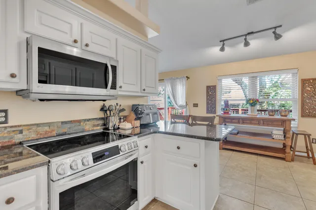 a kitchen with a stove and a microwave