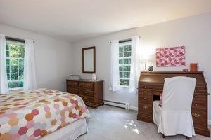 8 Tilson Road Rochester, MA 02770 - Photo 11 of 15 a bedroom with a bed and a chair