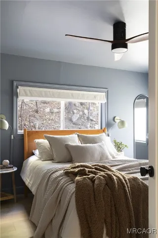 a bedroom with a bed and window