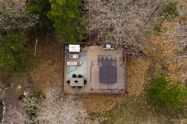 a view of a wooden door and brick wall