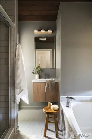 a living room with a couch and a potted plant