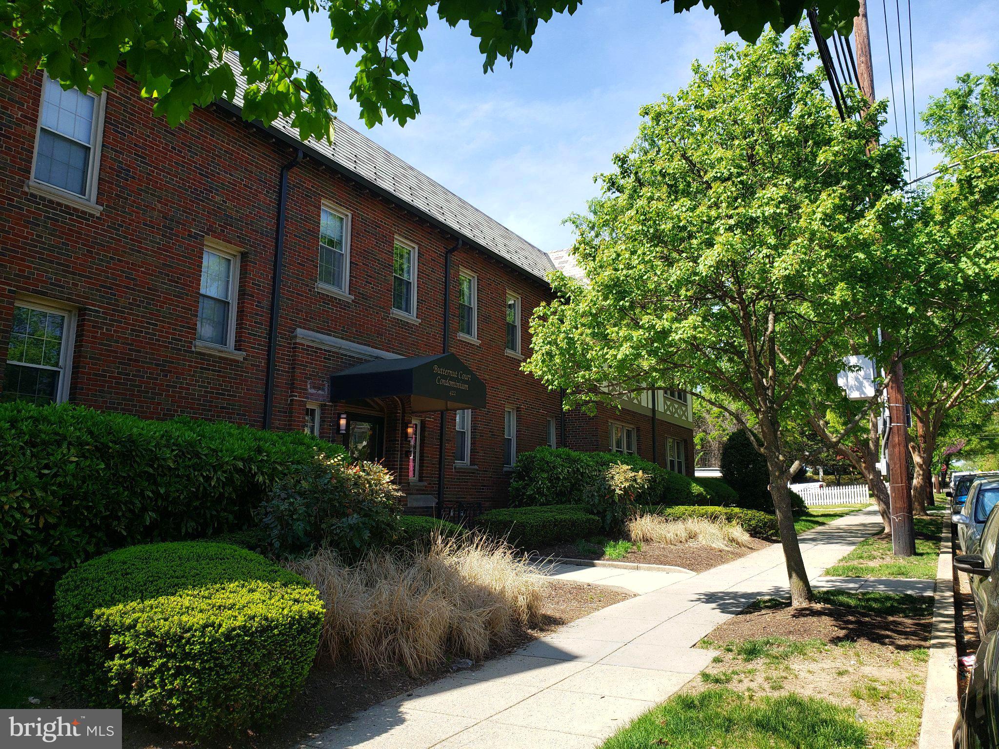422 Butternut Street Northwest, Unit T3 Washington, DC 20012 - Photo 29 of 30 Charming brick residence with lush greenery.