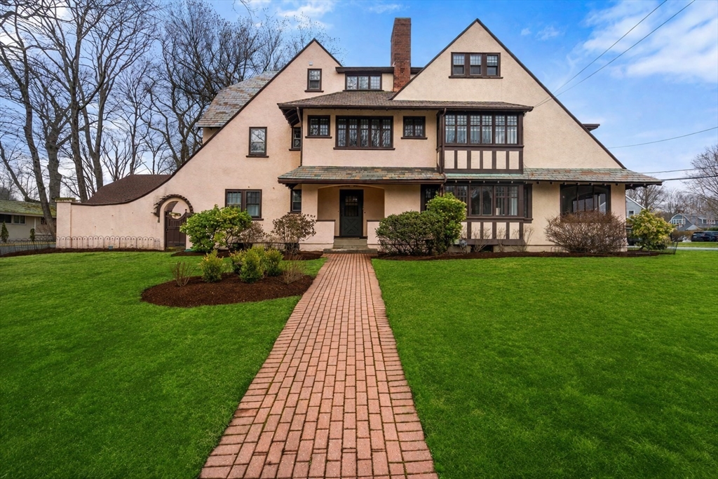 a front view of a house with a yard