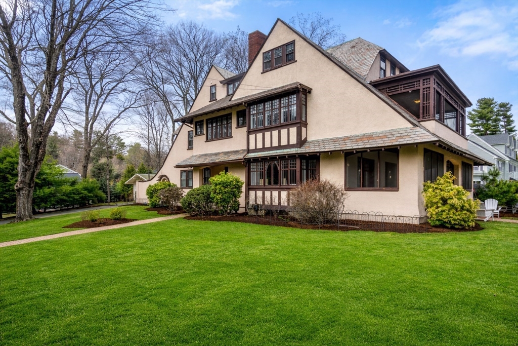 12 Leighton Road Wellesley, MA 02482 - Photo 2 of 34 a front view of a house with a garden and trees