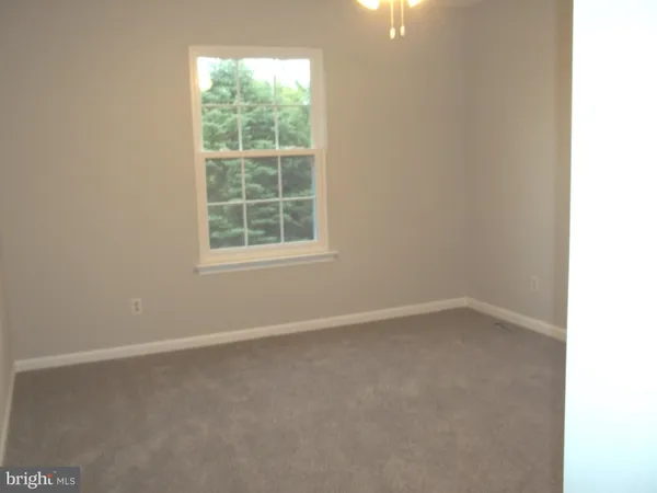 a view of a porch with wooden floor