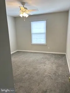 a view of a small room with a door