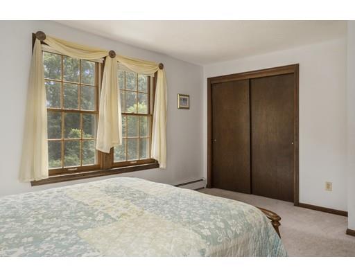 21 Crestview Drive Millis, MA 02054 - Photo 21 of 31 a bedroom with a bed and a large window