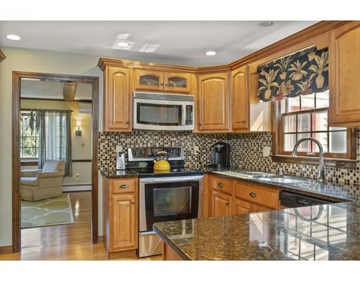 21 Crestview Drive Millis, MA 02054 - Photo 4 of 31 a kitchen with stainless steel appliances granite countertop a stove a sink and a microwave