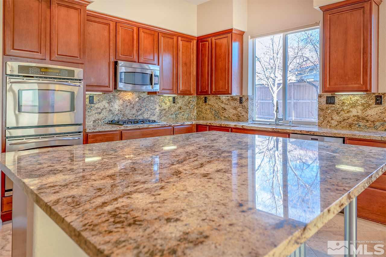 10645 Summer Glen Drive Reno, NV 89521 - Photo 12 of 25 a view of a kitchen with a sink and cabinets