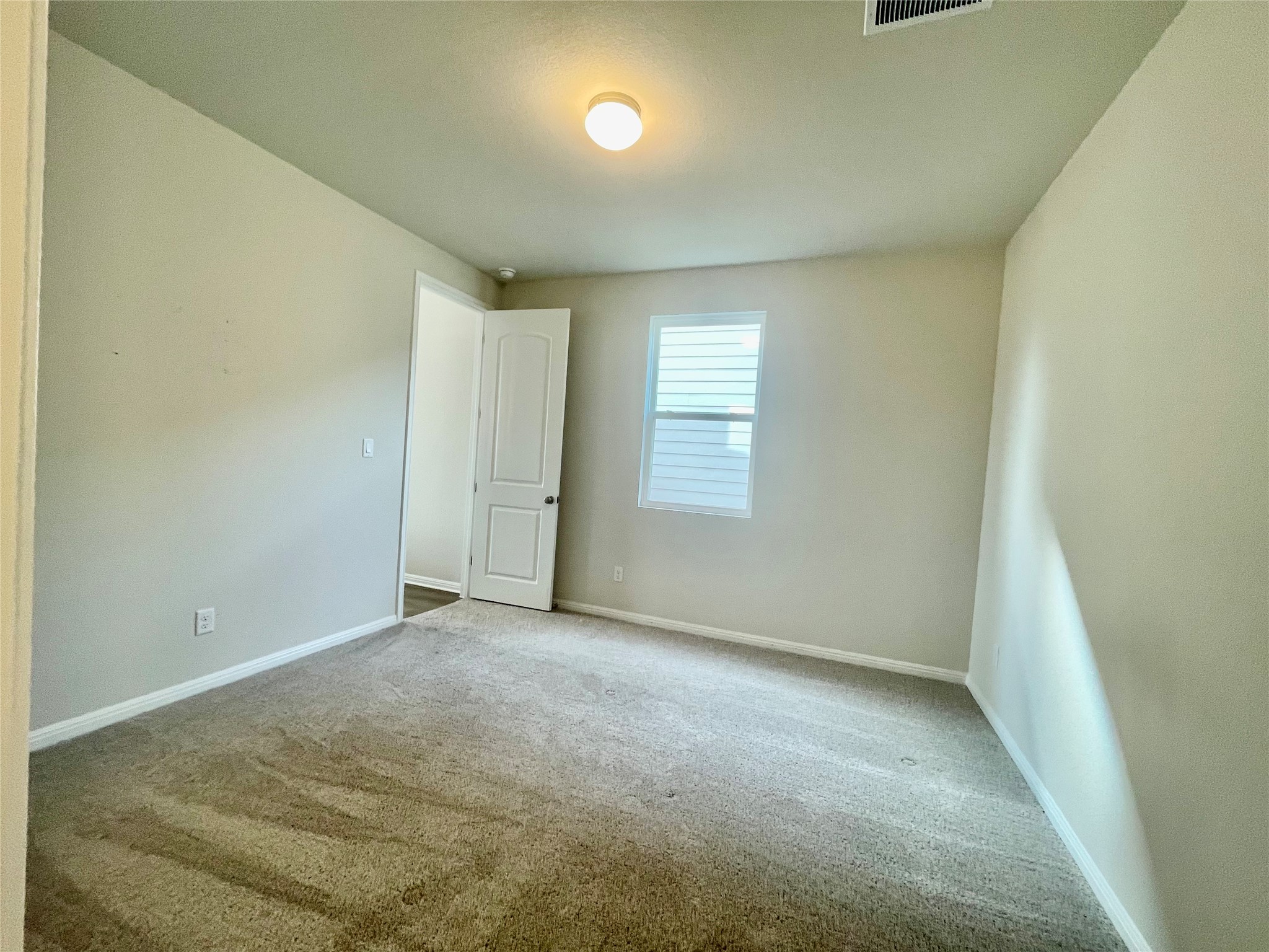 232 Denali Way Dripping Springs, TX 78620 - Photo 23 of 33 Empty room featuring baseboards and carpet