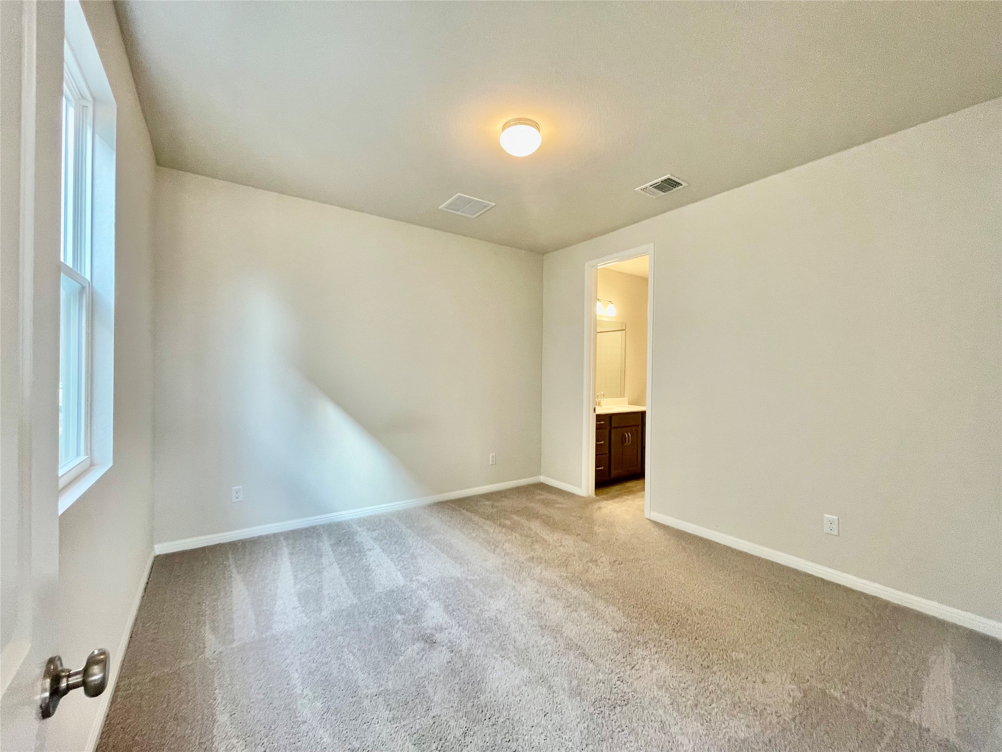 232 Denali Way Dripping Springs, TX 78620 - Photo 24 of 33 Spare room featuring light carpet and baseboards