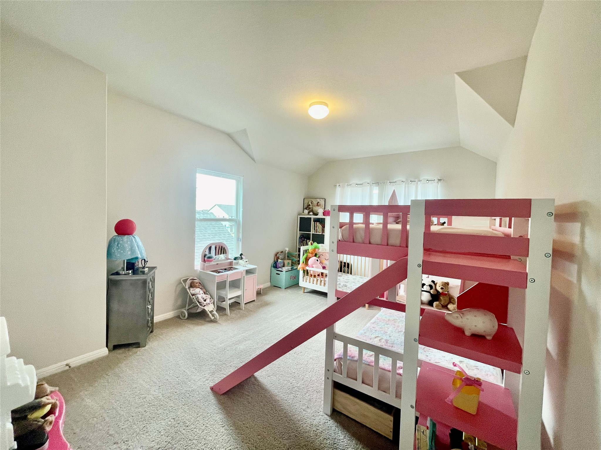 232 Denali Way Dripping Springs, TX 78620 - Photo 27 of 33 Carpeted bedroom featuring baseboards and lofted ceiling