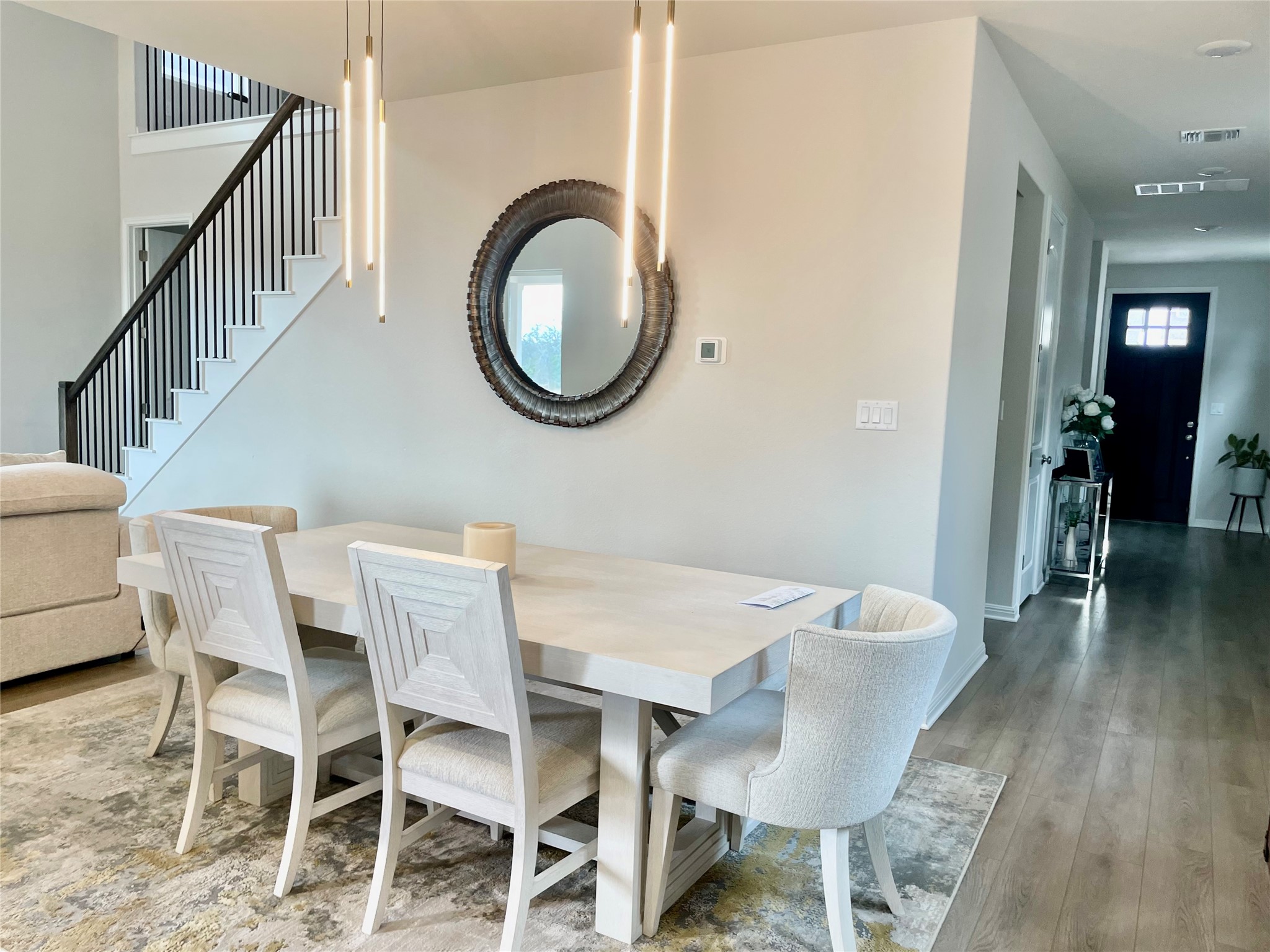 232 Denali Way Dripping Springs, TX 78620 - Photo 5 of 33 Dining area with light wood-style flooring and stairs
