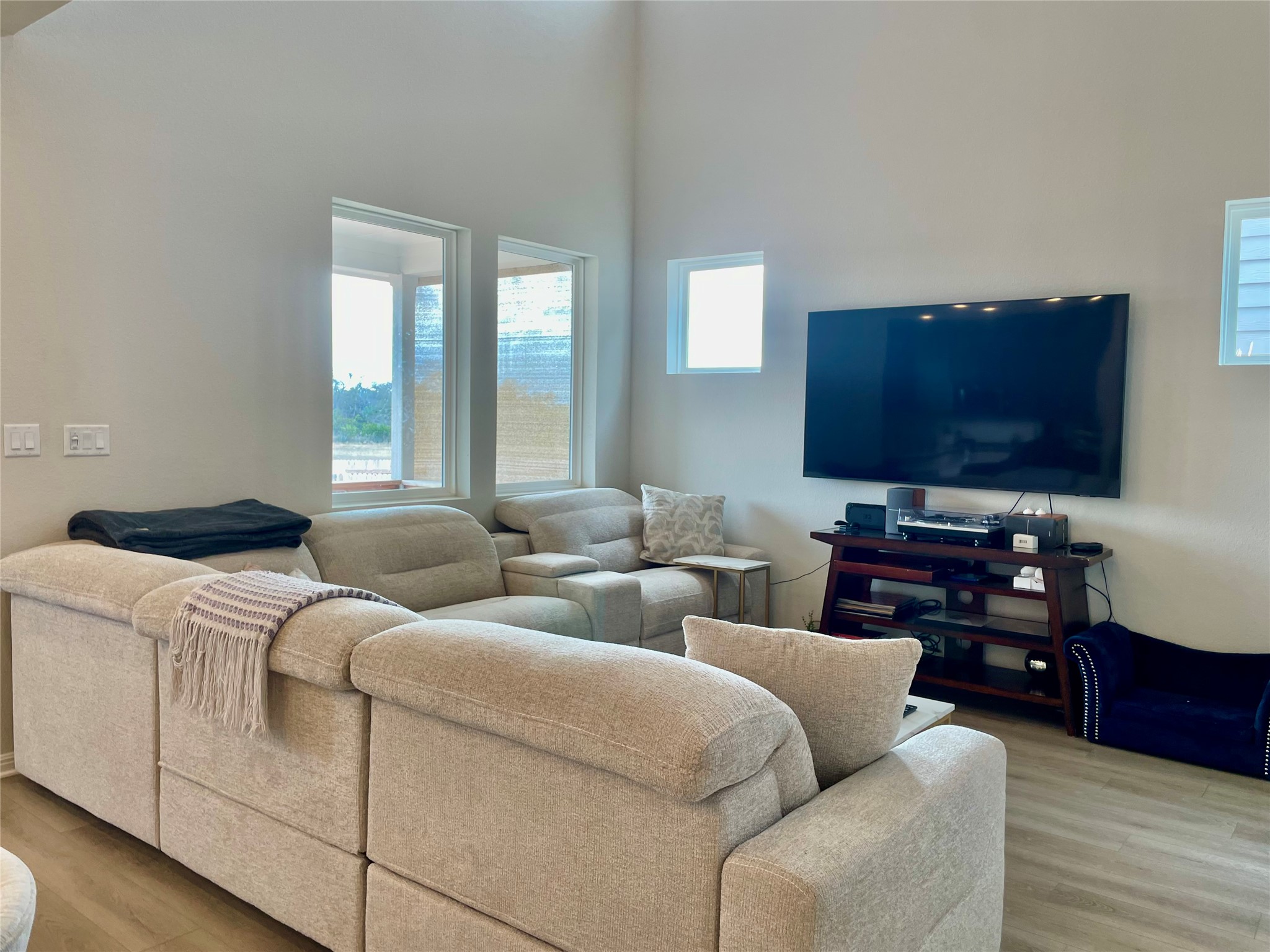 232 Denali Way Dripping Springs, TX 78620 - Photo 8 of 33 Living room featuring light wood-type flooring and a high ceiling