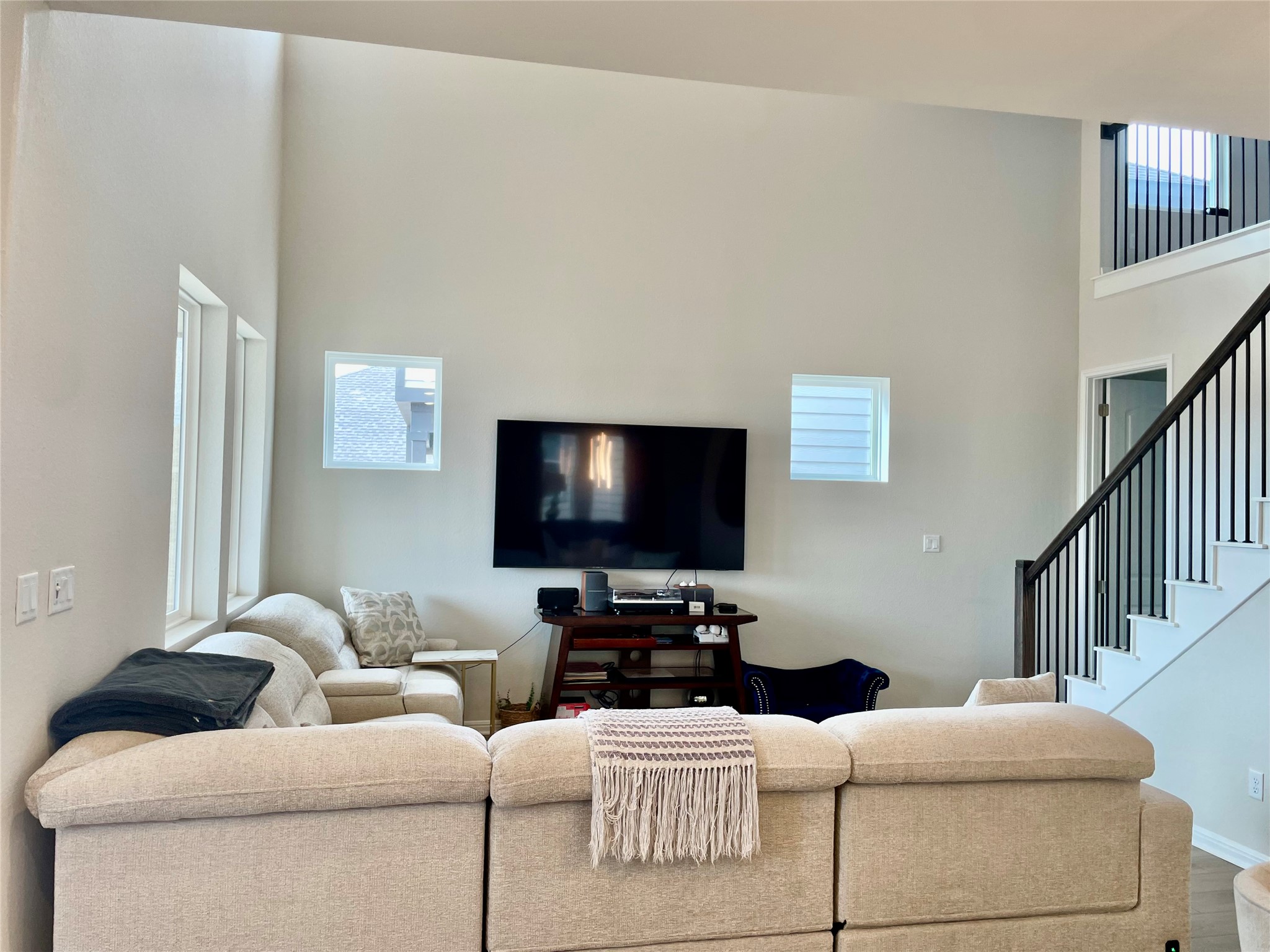 232 Denali Way Dripping Springs, TX 78620 - Photo 9 of 33 Living room featuring a high ceiling and wood finished floors