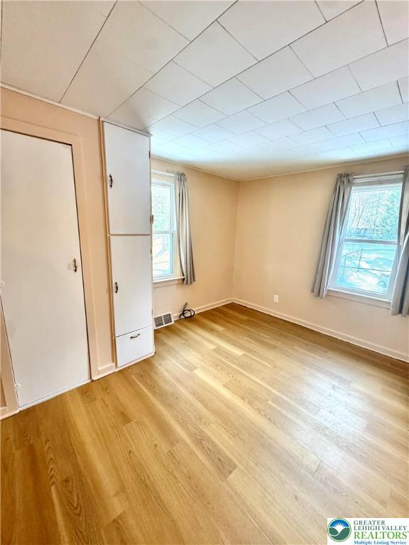 3210 Highway 309 Orefield, PA 18069 - Photo 11 of 17 wooden floor in an empty room with a window