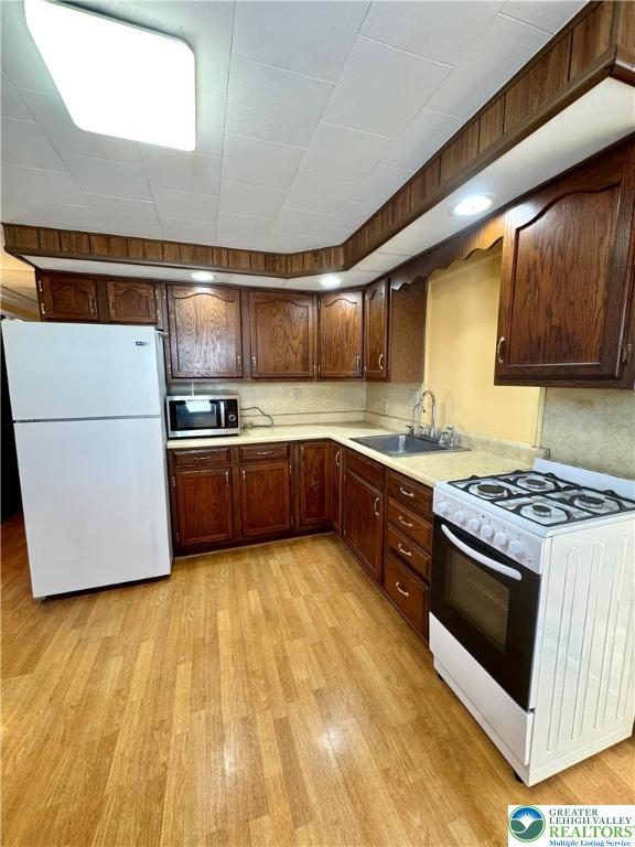 3210 Highway 309 Orefield, PA 18069 - Photo 5 of 17 a kitchen with stainless steel appliances granite countertop a stove a sink and a refrigerator