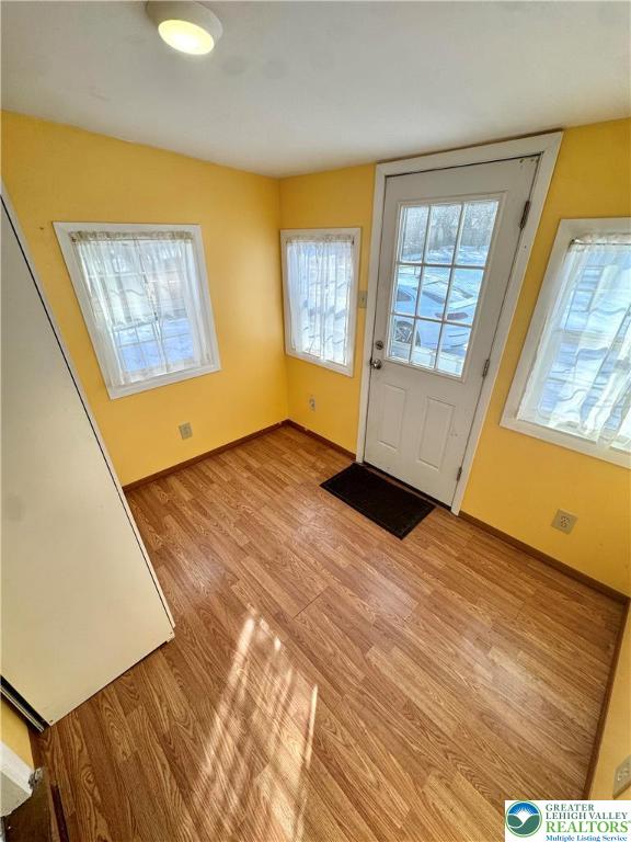 3210 Highway 309 Orefield, PA 18069 - Photo 6 of 17 a view of an empty room with wooden floor and a window