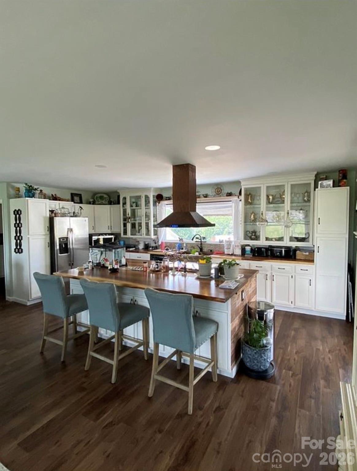 6042 Heavner Road Vale, NC 28168 - Photo 10 of 27 a room with stainless steel appliances kitchen island granite countertop furniture wooden floor and a kitchen view