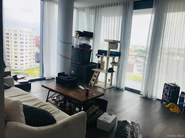 a living room with furniture and a window