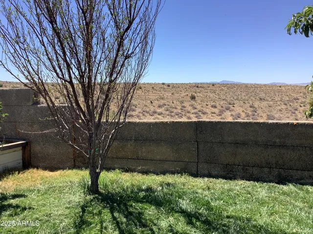 a view of a backyard of the house