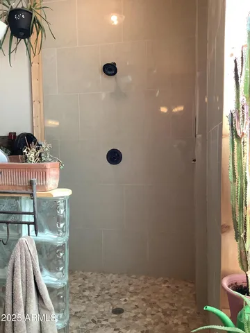 a bathroom with a sink toilet and a window