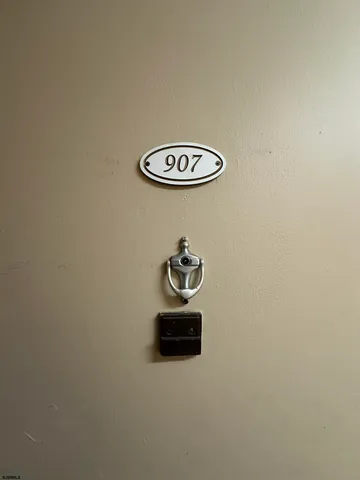 a white wall with a close up of a sink