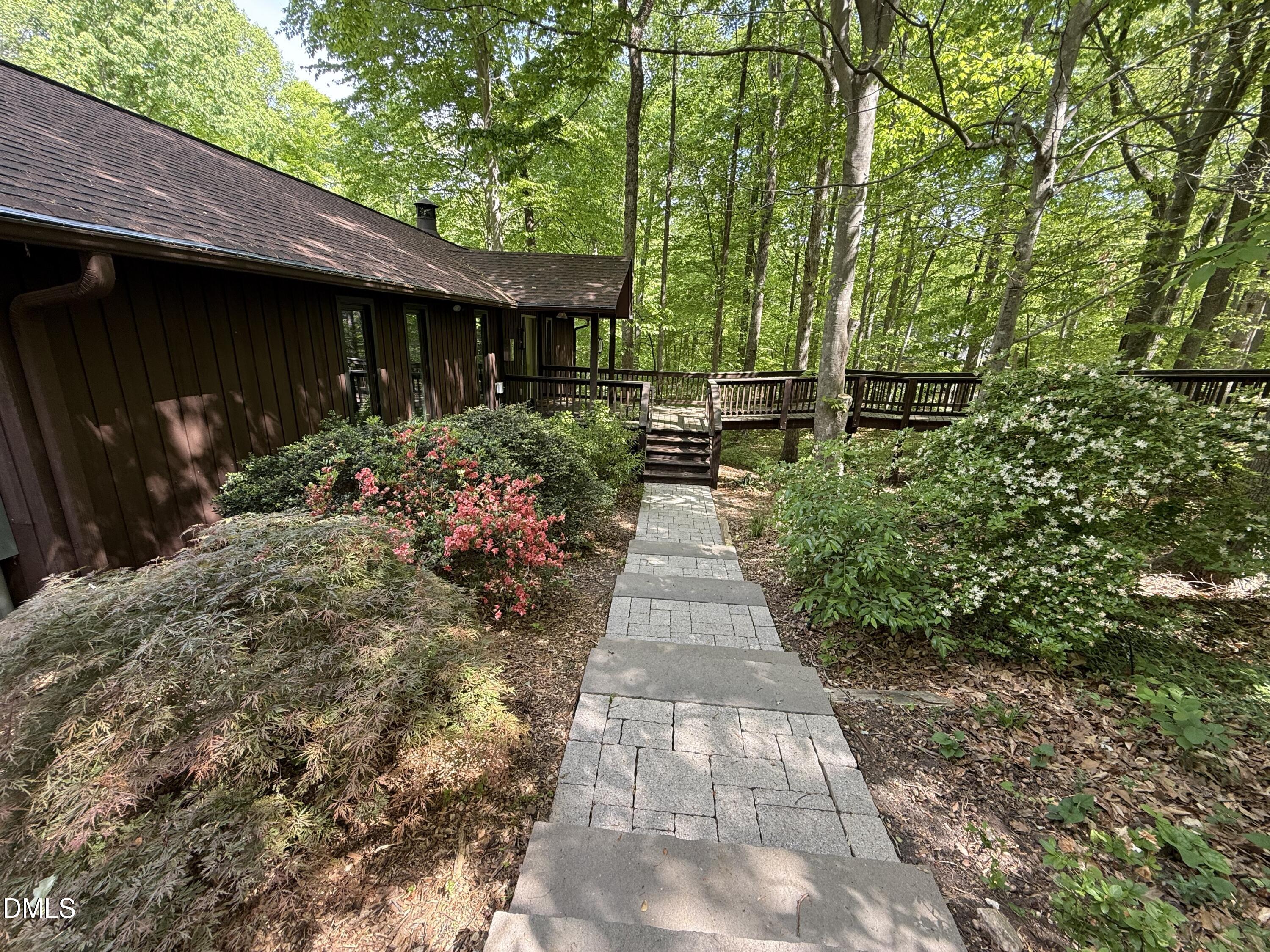 105 Barcliff Terrace Cary, NC 27518 - Photo 31 of 47 a view of a house with a garden