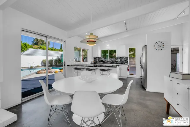 a kitchen with cabinets and stainless steel appliances