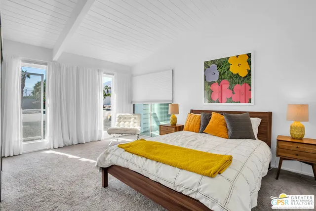 a bed room with a bed and a couch