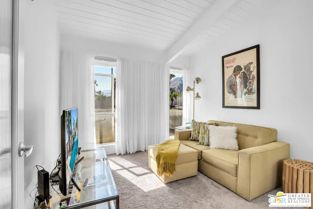 a view of a backyard with swimming pool