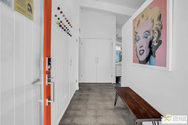 a living room with furniture a window and a dining table