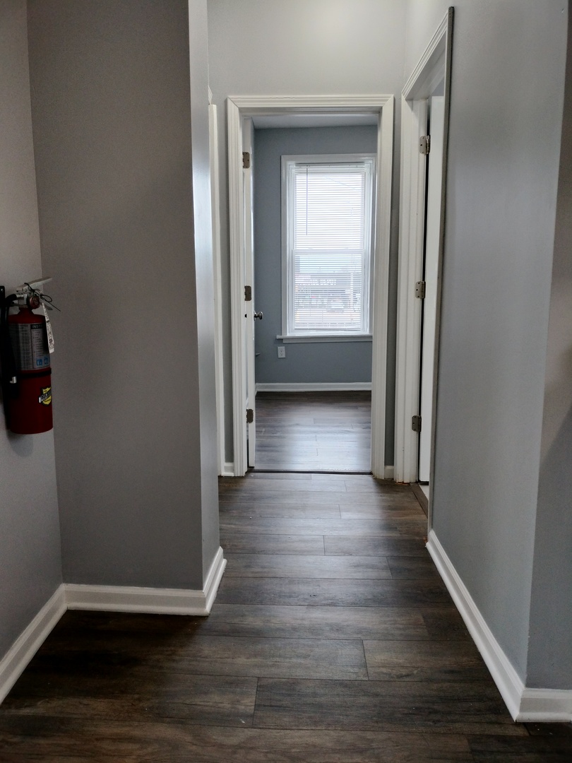 6601 South Green Street, Unit 8171 Chicago, IL 60621 - Photo 12 of 28 a view of a hallway with wooden floor and closet
