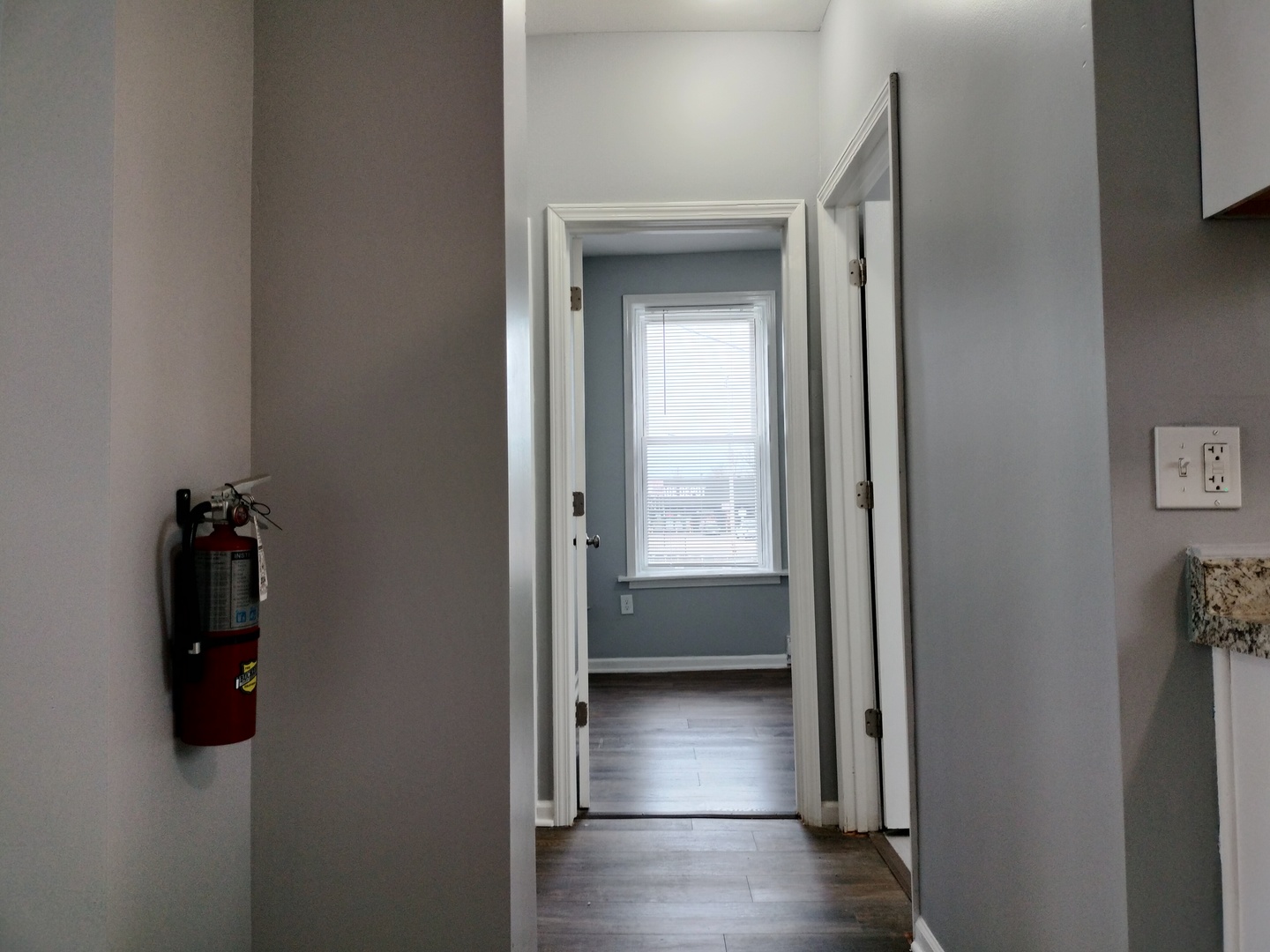 6601 South Green Street, Unit 8171 Chicago, IL 60621 - Photo 13 of 28 a view of empty room with windows and cabinet