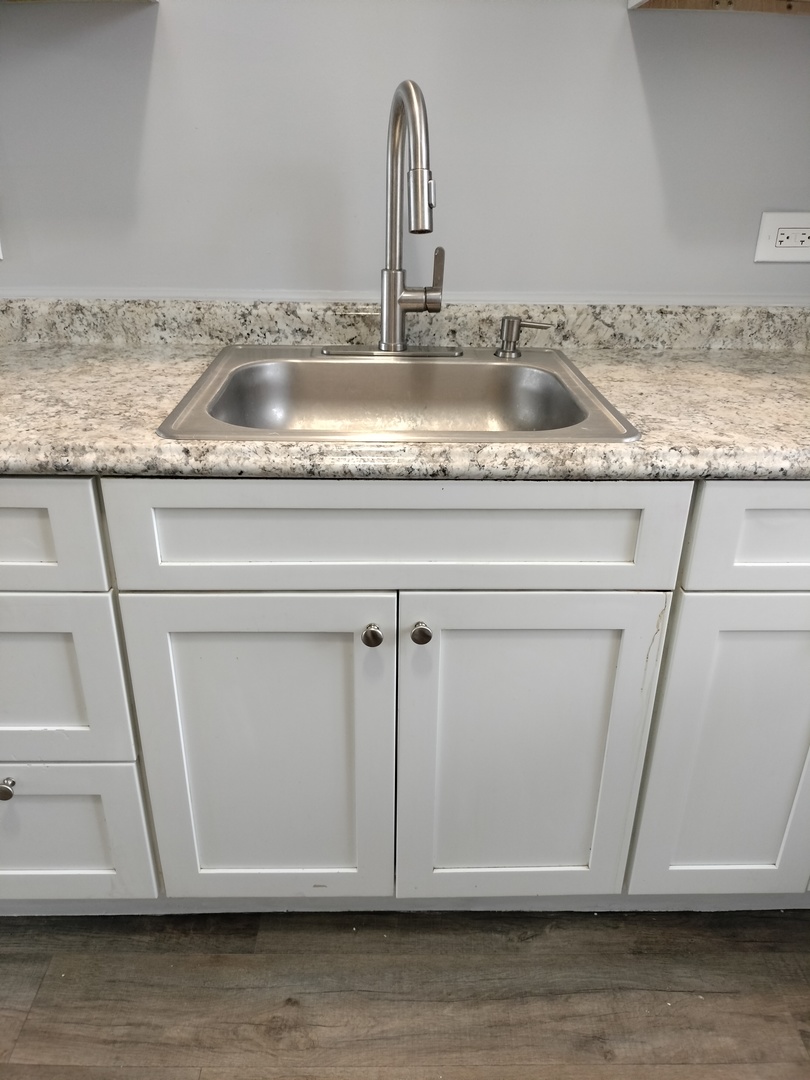 6601 South Green Street, Unit 8171 Chicago, IL 60621 - Photo 9 of 28 a close view of sink and tap