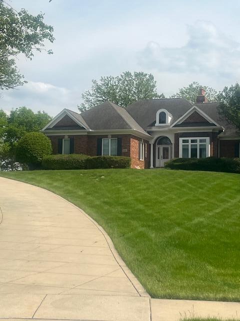 9261 Ruth Court St. John, IN 46373 - Photo 2 of 48 a front view of a house with a garden
