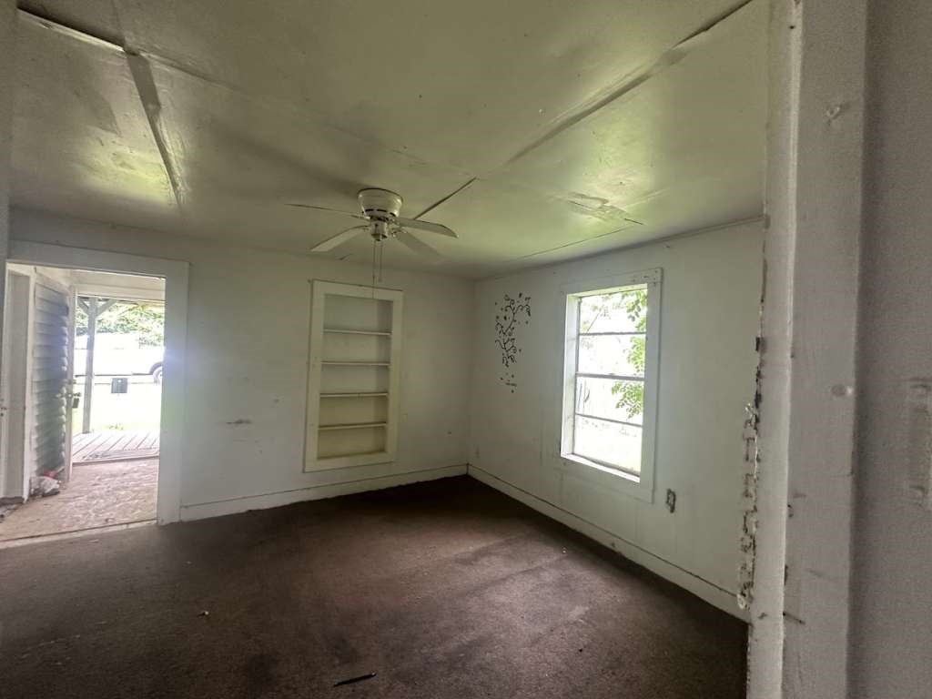 302 West Jackson Kosse, TX 76653 - Photo 4 of 12 an empty room with windows