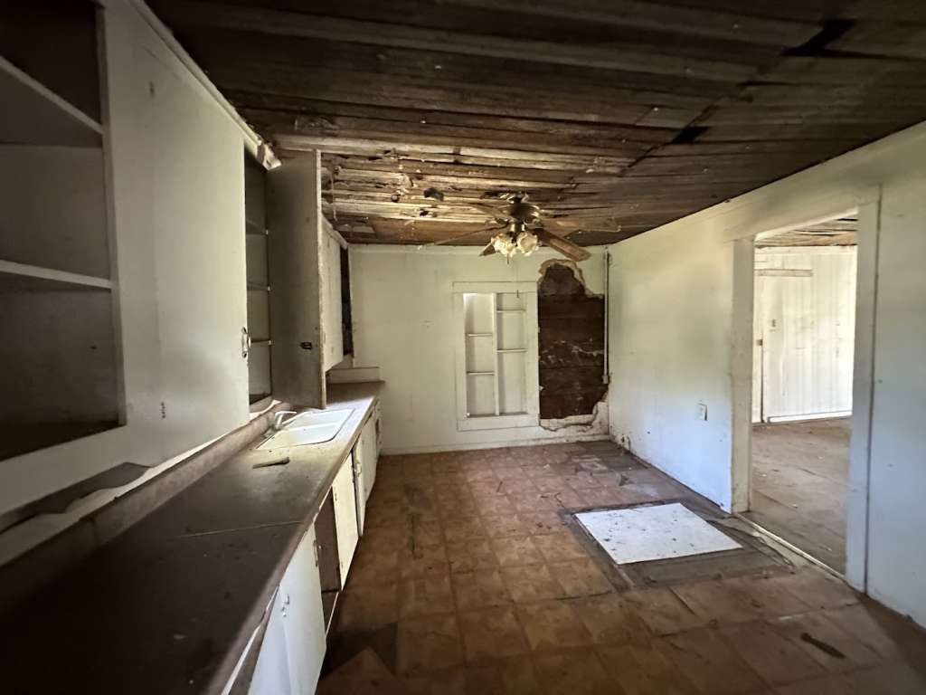 302 West Jackson Kosse, TX 76653 - Photo 6 of 12 a view of a hallway with wooden floor