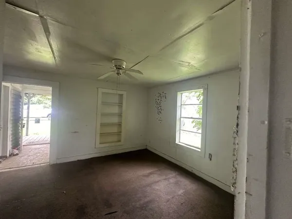an empty room with windows