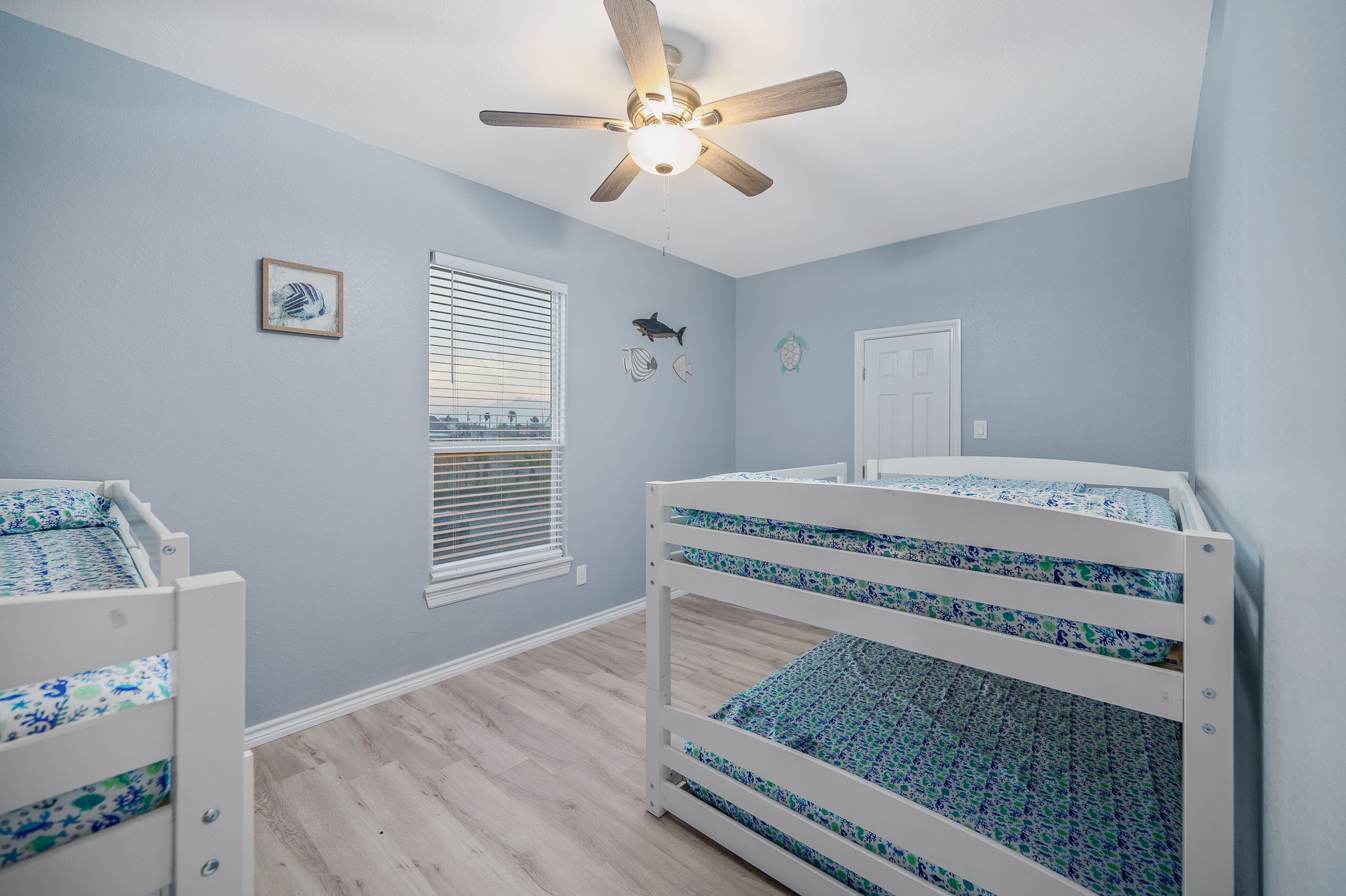 305 Jettyview Road, Unit A Surfside Beach, TX 77541 - Photo 15 of 41 a bedroom with a bed and a window