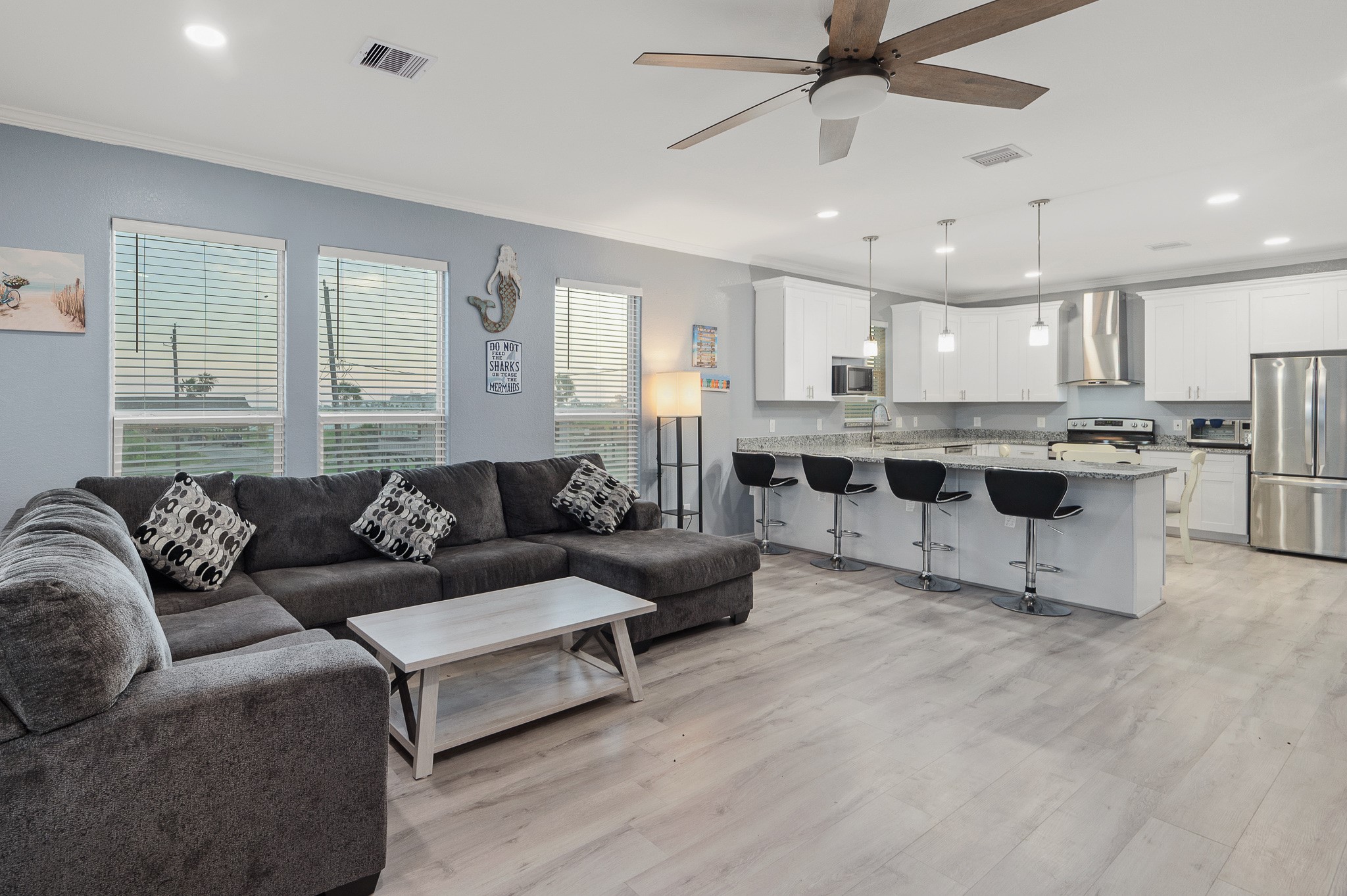 305 Jettyview Road, Unit A Surfside Beach, TX 77541 - Photo 2 of 41 a living room with furniture and a large window