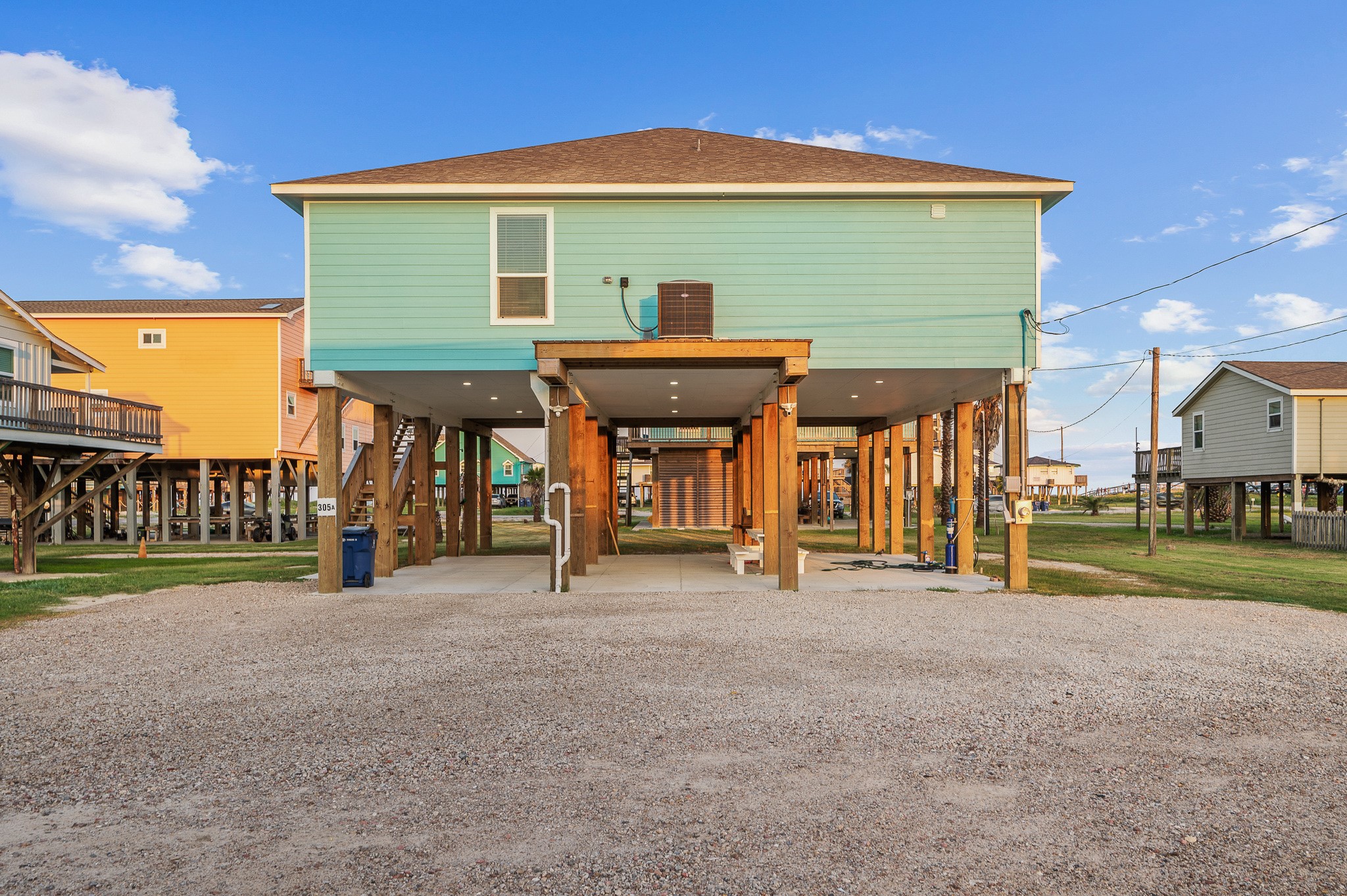 305 Jettyview Road, Unit A Surfside Beach, TX 77541 - Photo 27 of 41 a front view of a house with a yard